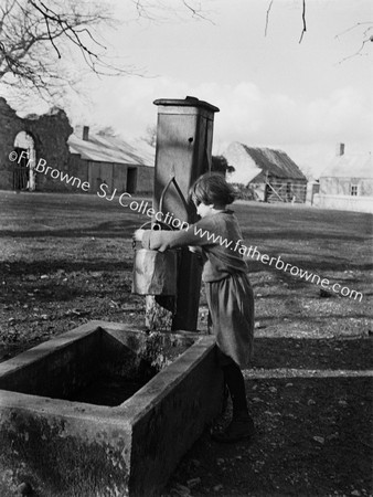 GIRL AT VILLAGE PUMP